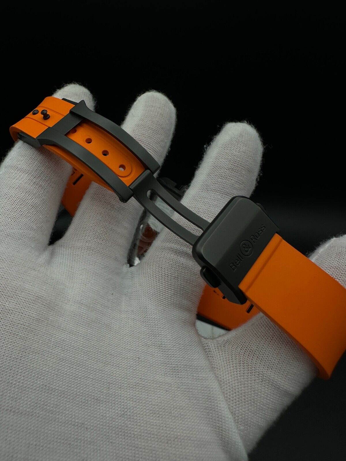 Bell & Ross Limited Edition BR-X5 Carbon Orange BRX5R-BO-TC/SRB, 2023 model, featuring a 41mm Grade 2 microblasted titanium case with DLC finish, matte black dial, and orange rubber strap with folding buckle. The dial has applique indices filled with Super-LumiNova® and skeletonized metal hands. The fixed bezel is made of Grade 2 microblasted titanium with a matt carbon fiber insert. Very good condition with minimal signs of wear. Limited edition of 500 pieces. Includes inner and outer boxes, warranty card,