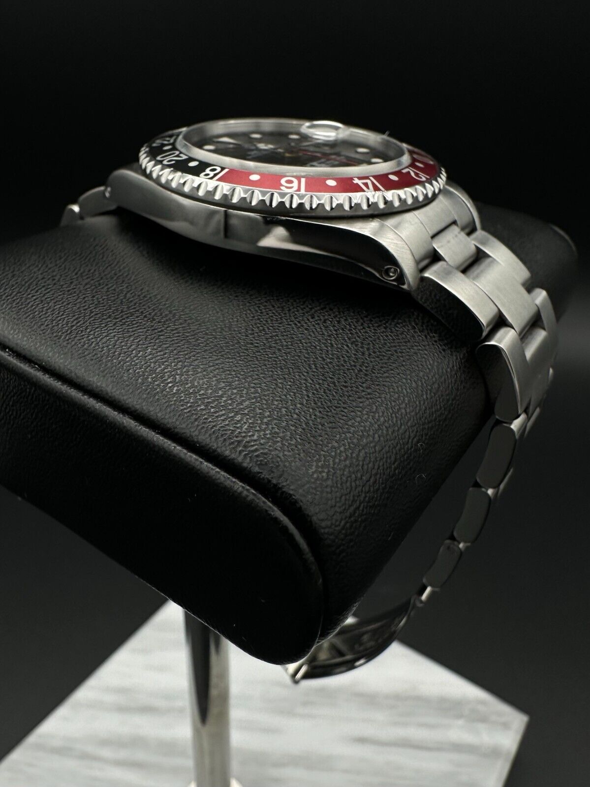 Rolex GMT-Master II men's automatic watch, model 16710, featuring the classic 'Coke' bezel and stainless steel oyster bracelet, 1993 release. This iconic 40mm timepiece combines functionality with a timeless design, perfect for collectors and enthusiasts of luxury watches. Available from The Watch Trader CT.