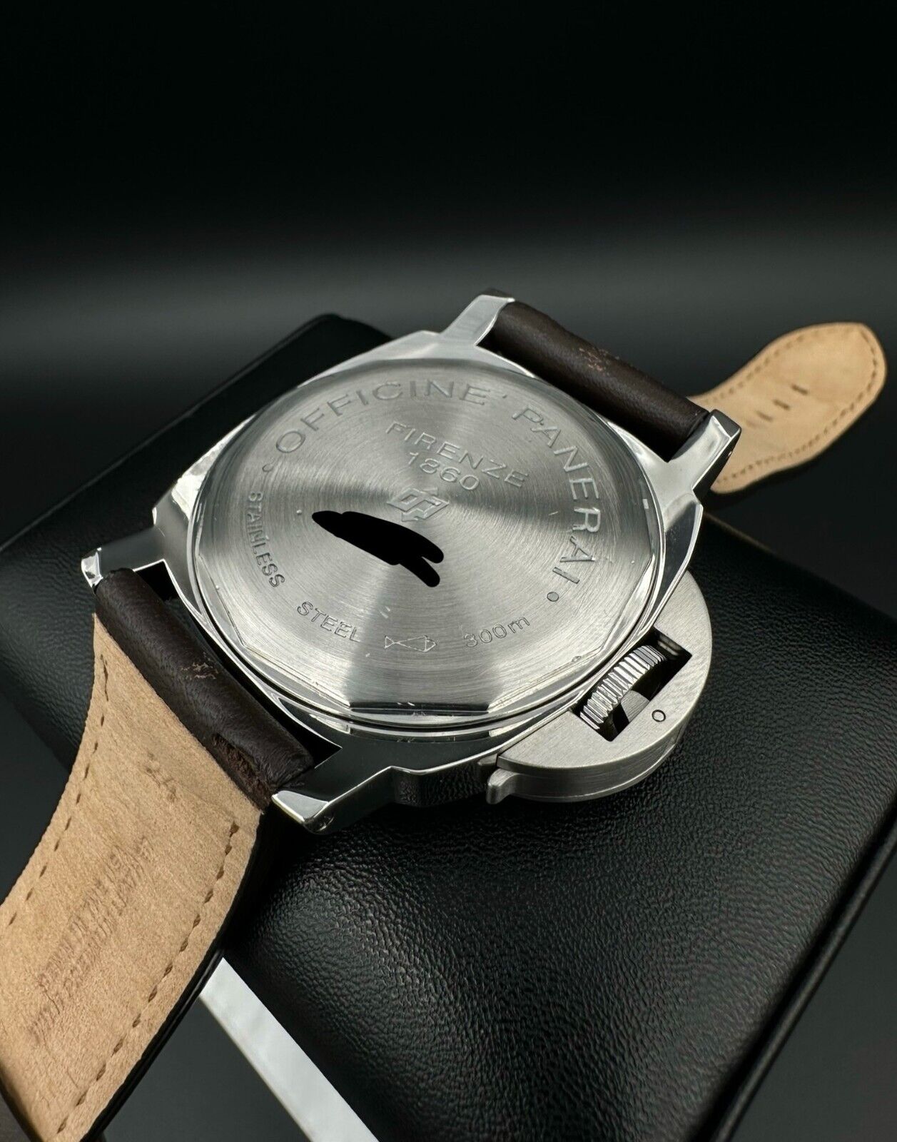 Panerai Luminor Marina PAM001 men's watch, featuring a 44mm stainless steel case and bold black dial. This iconic timepiece combines Panerai's renowned design with exceptional durability, making it ideal for collectors seeking a reliable and stylish luxury watch. Available from The Watch Trader in Madison, Connecticut.