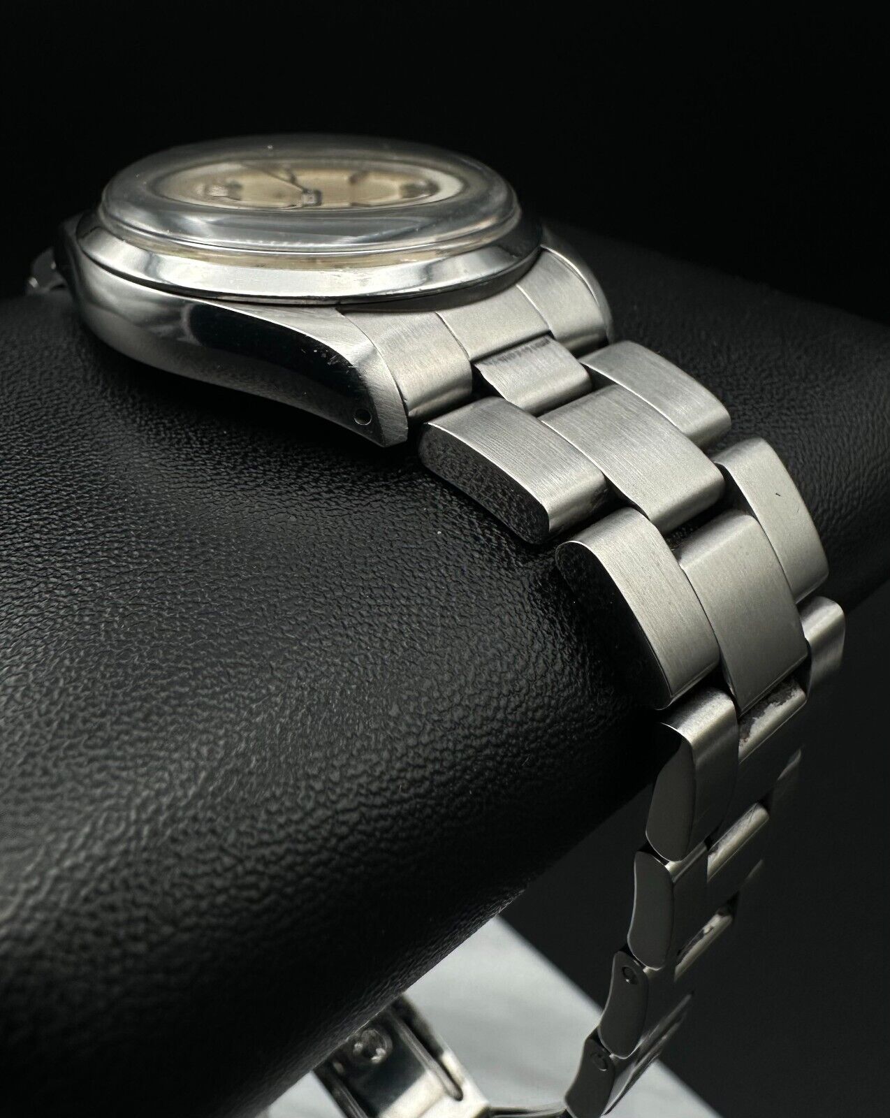 Rolex Air-King 5500, 1987 model, featuring a 34mm stainless steel case, silver dial, and stainless steel Rolex Oyster bracelet. Fair condition with noticeable signs of wear. Includes warranty papers and service certificate. Available at The Watch Trader, Madison, Connecticut.
