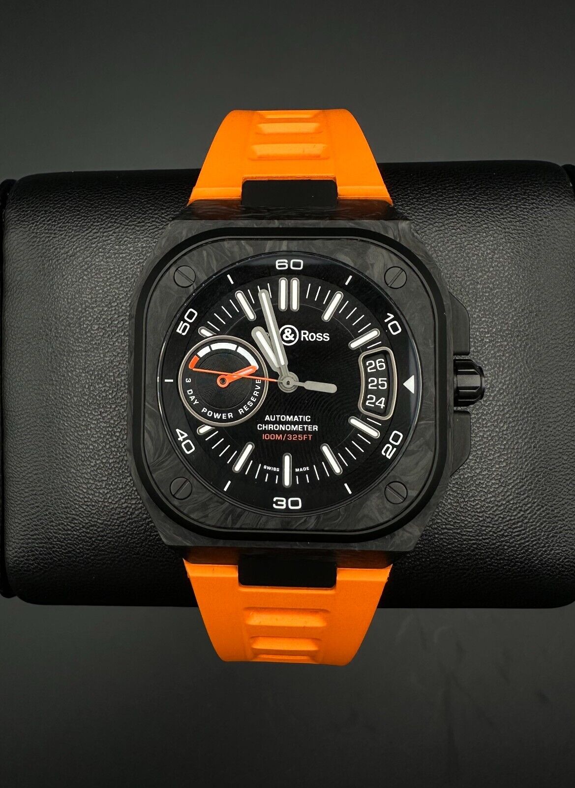 Bell & Ross Limited Edition BR-X5 Carbon Orange BRX5R-BO-TC/SRB, 2023 model, featuring a 41mm Grade 2 microblasted titanium case with DLC finish, matte black dial, and orange rubber strap with folding buckle. The dial has applique indices filled with Super-LumiNova® and skeletonized metal hands. The fixed bezel is made of Grade 2 microblasted titanium with a matt carbon fiber insert. Very good condition with minimal signs of wear. Limited edition of 500 pieces. Includes inner and outer boxes, warranty card,