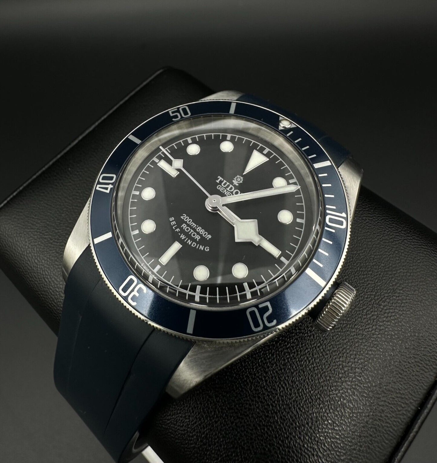 Tudor Heritage Black Bay men's automatic watch, model 79220B, with distinctive black 'Smiley' dial and 2014 release. Features a classic 41mm stainless steel case and vintage-inspired design, ideal for collectors of iconic timepieces. Available from The Watch Trader CT.