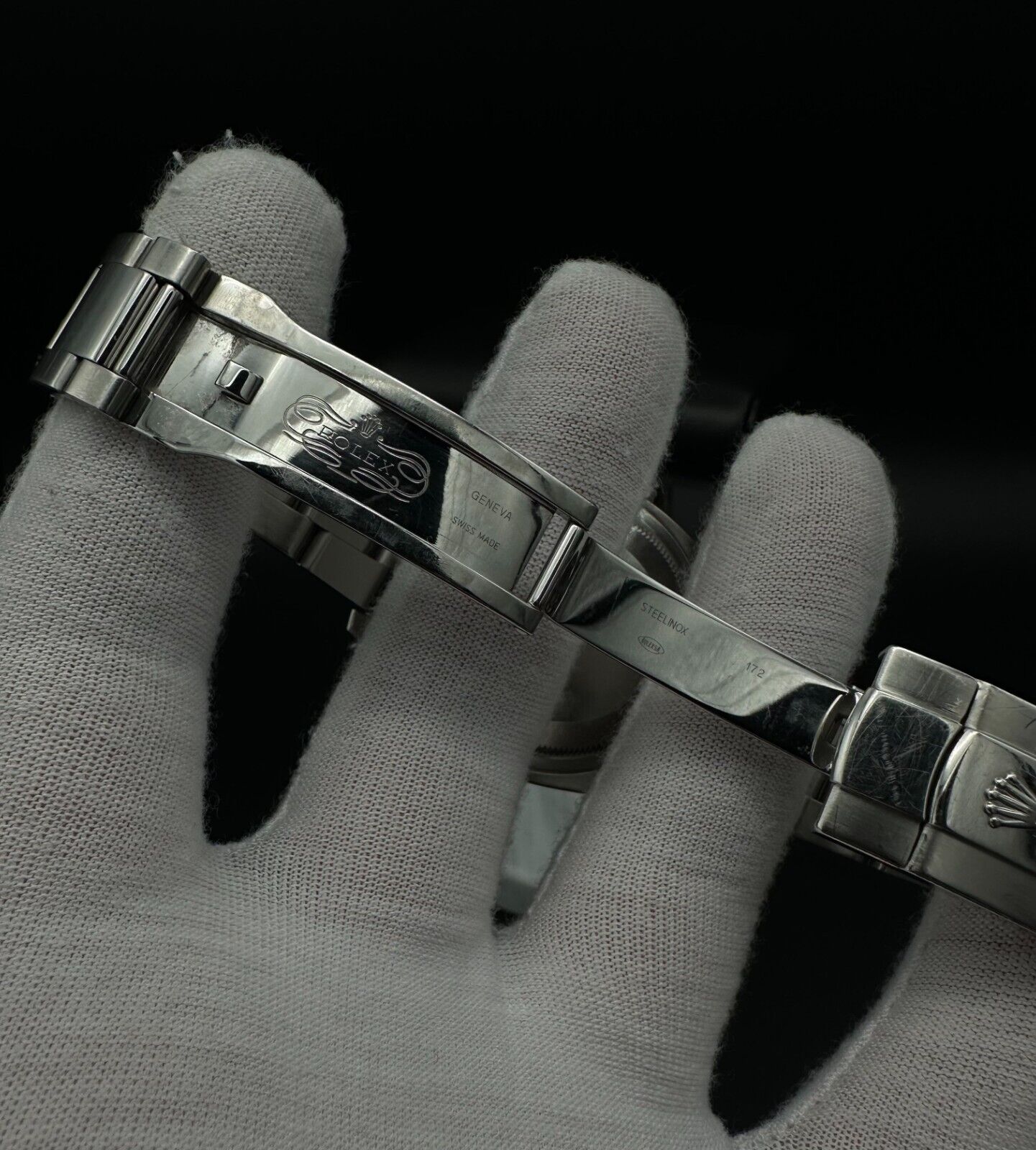Rolex Datejust 36mm watch, model 116200, featuring a white Roman numeral dial and stainless steel Oyster bracelet. This classic automatic timepiece embodies refined elegance and versatility, perfect for collectors and enthusiasts seeking a timeless luxury watch. Available from The Watch Trader in Madison, Connecticut.