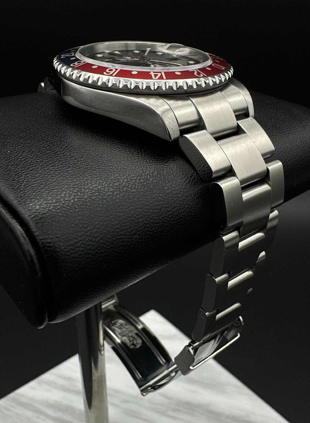 Rolex GMT-Master II automatic watch, model 16710, featuring the iconic 'Pepsi' bezel and stainless steel oyster bracelet, 2004 release. This 40mm timepiece combines functionality and classic style, ideal for collectors and travelers seeking a versatile luxury watch. Available from The Watch Trader CT.
