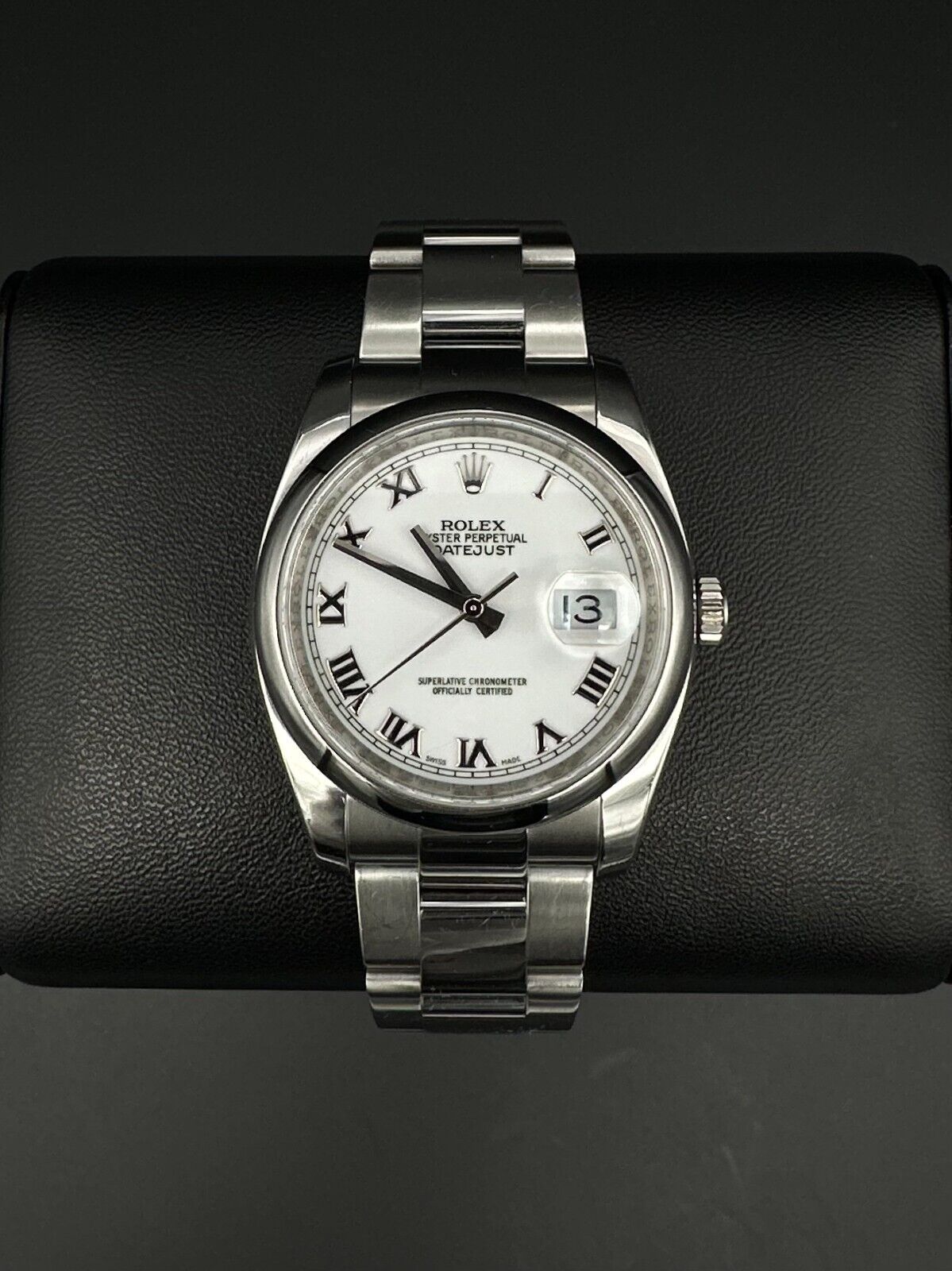 Rolex Datejust 36mm watch, model 116200, featuring a white Roman numeral dial and stainless steel Oyster bracelet. This classic automatic timepiece embodies refined elegance and versatility, perfect for collectors and enthusiasts seeking a timeless luxury watch. Available from The Watch Trader in Madison, Connecticut.