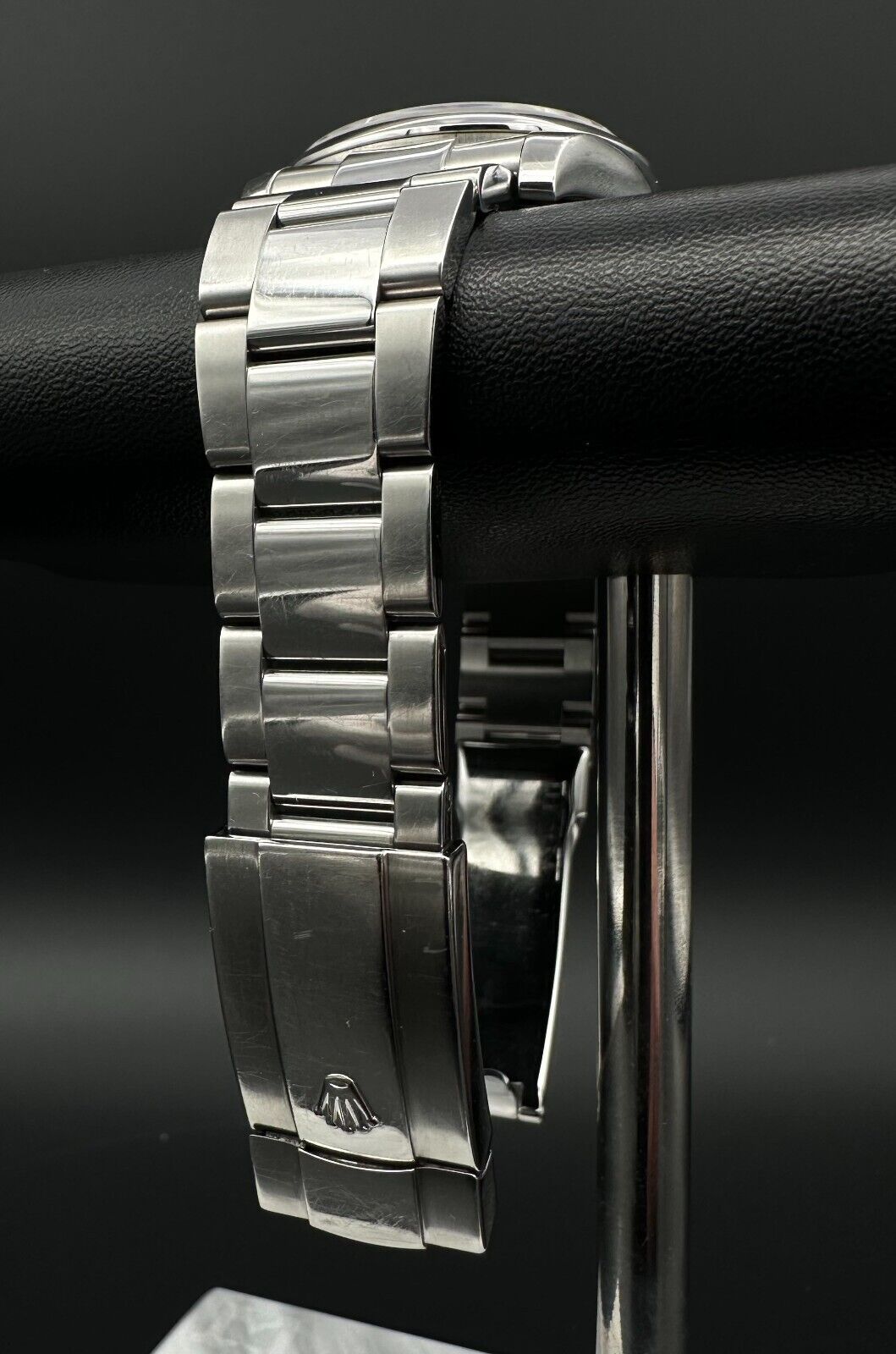 Rolex Datejust 36mm watch, model 116200, featuring a white Roman numeral dial and stainless steel Oyster bracelet. This classic automatic timepiece embodies refined elegance and versatility, perfect for collectors and enthusiasts seeking a timeless luxury watch. Available from The Watch Trader in Madison, Connecticut.