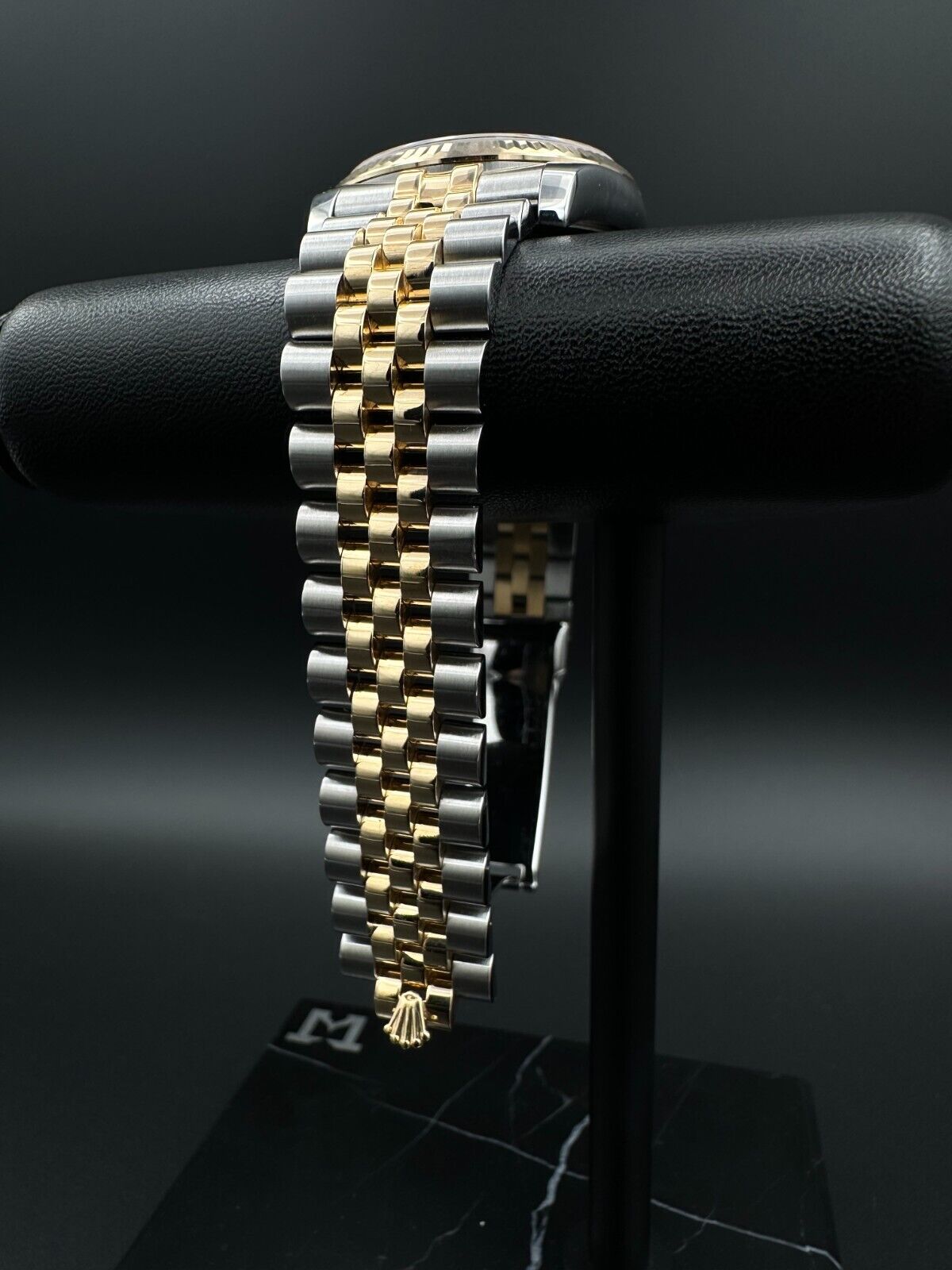 Rolex Datejust 36mm automatic watch, model 116233, featuring a white Anniversary dial and Super Jubilee bracelet. This sophisticated timepiece combines elegant design with Rolex's signature craftsmanship, ideal for collectors and enthusiasts seeking a refined luxury watch. Available from The Watch Trader in Madison, Connecticut