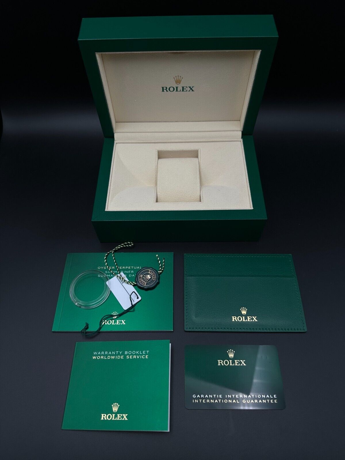 Rolex Submariner Date 126610LV "Starbucks" Men's Watch, 2024 model, featuring a 41mm stainless steel case, black dial, and green ceramic unidirectional rotating bezel. Comes with a stainless steel Rolex Oyster bracelet. Fair condition with visible signs of wear. Available at The Watch Trader, Madison, Connecticut.