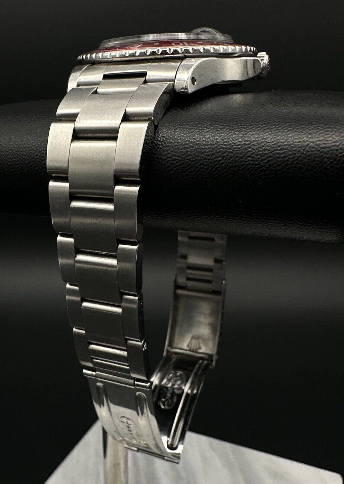 Rolex GMT-Master 1675 automatic watch, featuring the iconic 'Pepsi' bezel and stainless steel oyster bracelet, from 1972. This vintage 40mm timepiece combines classic design with dual-timezone functionality, making it ideal for collectors and enthusiasts of historical luxury watches. Available from The Watch Trader CT.