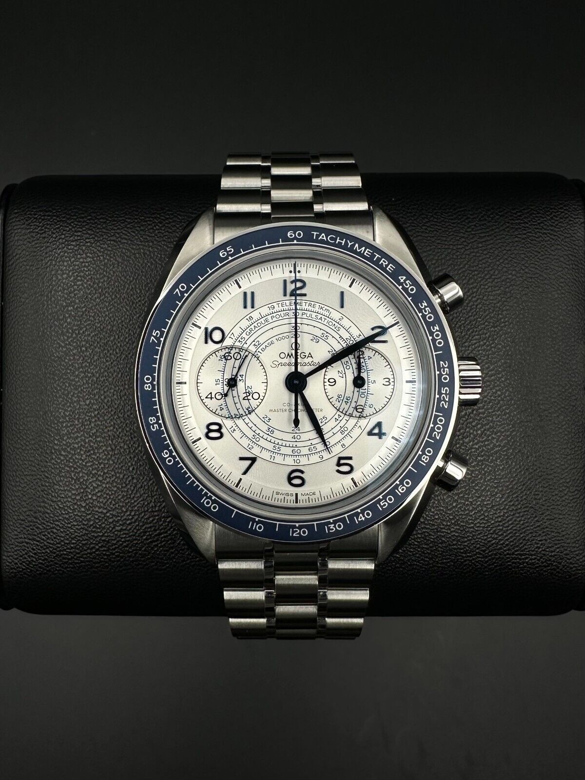 OMEGA Speedmaster Chronoscope 329.30.43.51.02.001 Automatic Watch, 2024 model, featuring a 43mm stainless steel case, silver dial, and blue anodized aluminum bezel ring with tachymeter scale. Comes with a stainless steel bracelet and fold-over clasp. Very good condition with minimal signs of wear. Available at The Watch Trader, Madison, Connecticut.