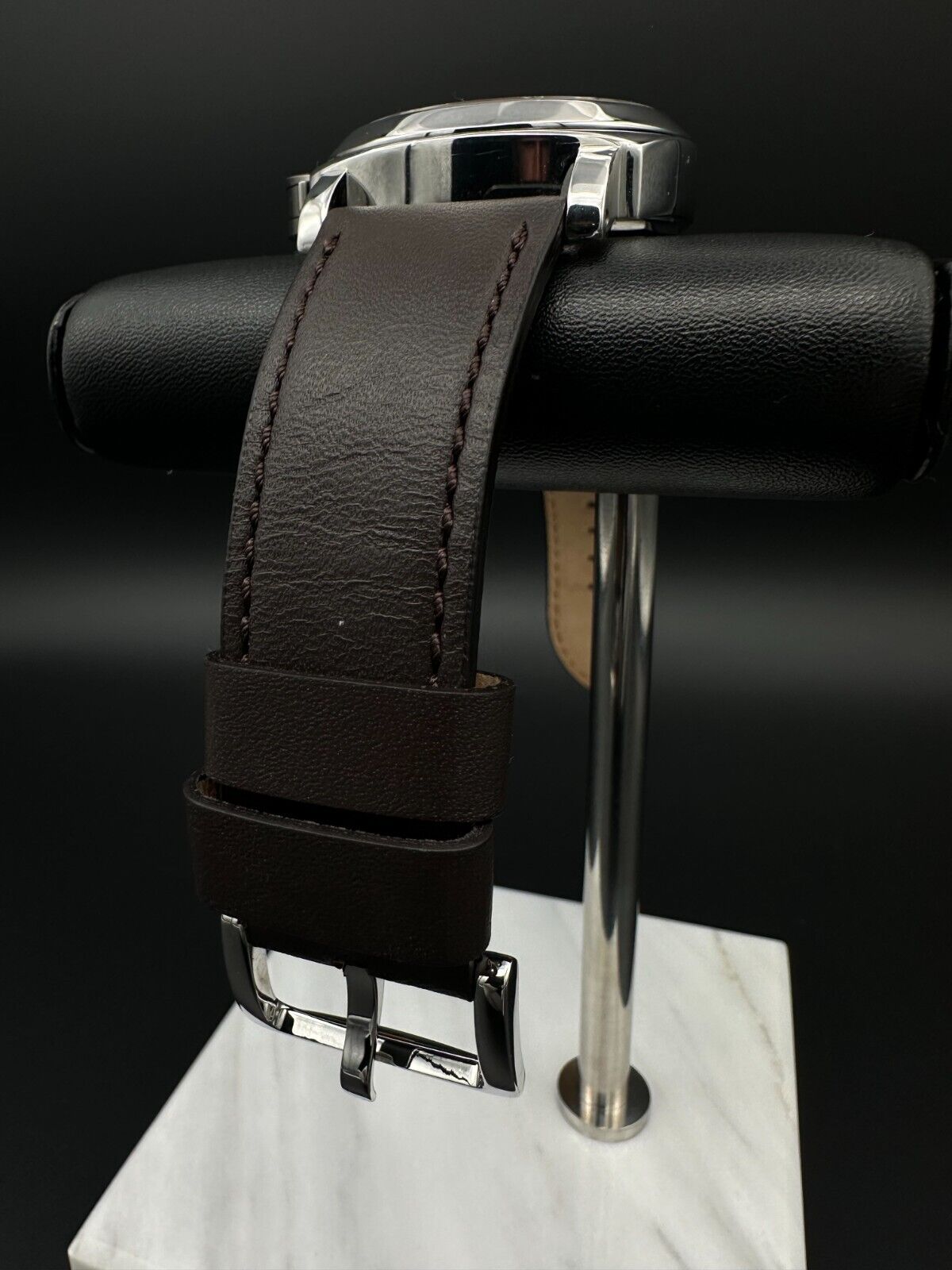 Panerai Luminor Marina PAM001 men's watch, featuring a 44mm stainless steel case and bold black dial. This iconic timepiece combines Panerai's renowned design with exceptional durability, making it ideal for collectors seeking a reliable and stylish luxury watch. Available from The Watch Trader in Madison, Connecticut.