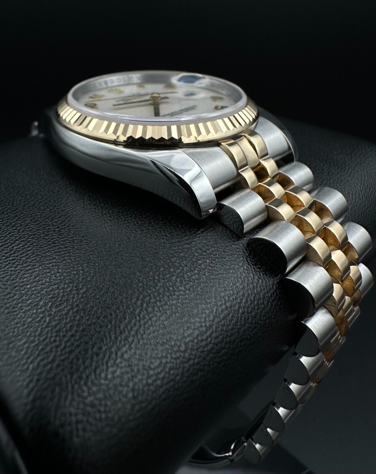 Rolex Datejust 36mm automatic watch, model 116233, featuring a white Anniversary dial and Super Jubilee bracelet. This sophisticated timepiece combines elegant design with Rolex's signature craftsmanship, ideal for collectors and enthusiasts seeking a refined luxury watch. Available from The Watch Trader in Madison, Connecticut