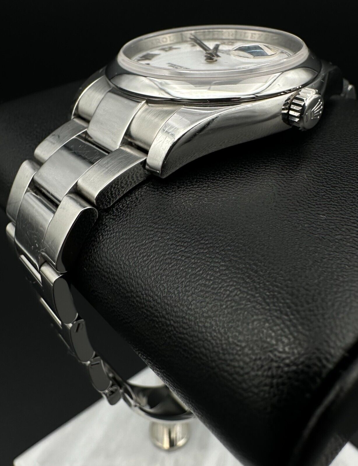 Rolex Datejust 36mm watch, model 116200, featuring a white Roman numeral dial and stainless steel Oyster bracelet. This classic automatic timepiece embodies refined elegance and versatility, perfect for collectors and enthusiasts seeking a timeless luxury watch. Available from The Watch Trader in Madison, Connecticut.