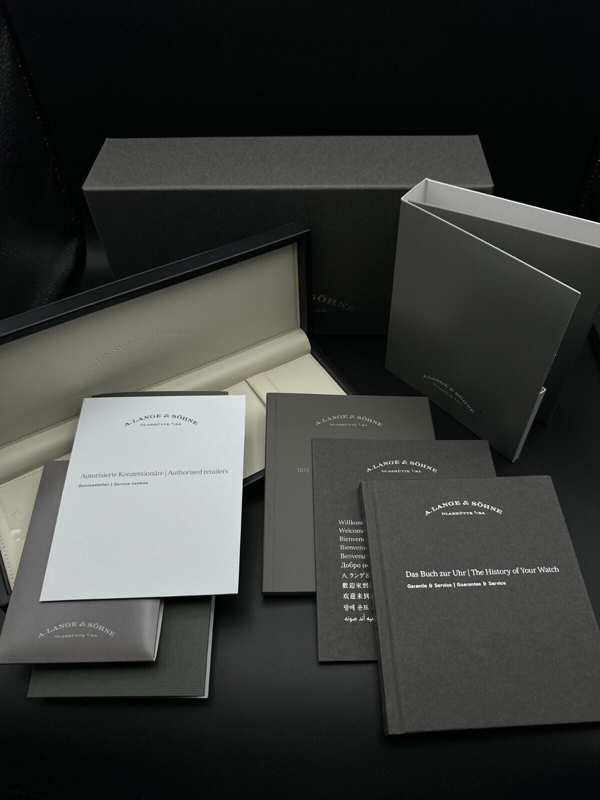 A. Lange & Söhne 1815 Up/Down 234.032, 39mm 18K rose gold case with silver dial, blued alpha-style hands, and power reserve indicator. Very good condition with minimal wear. Includes boxes, warranty booklet, microfiber cloths, and booklets. Available at The Watch Trader, Madison, Connecticut.