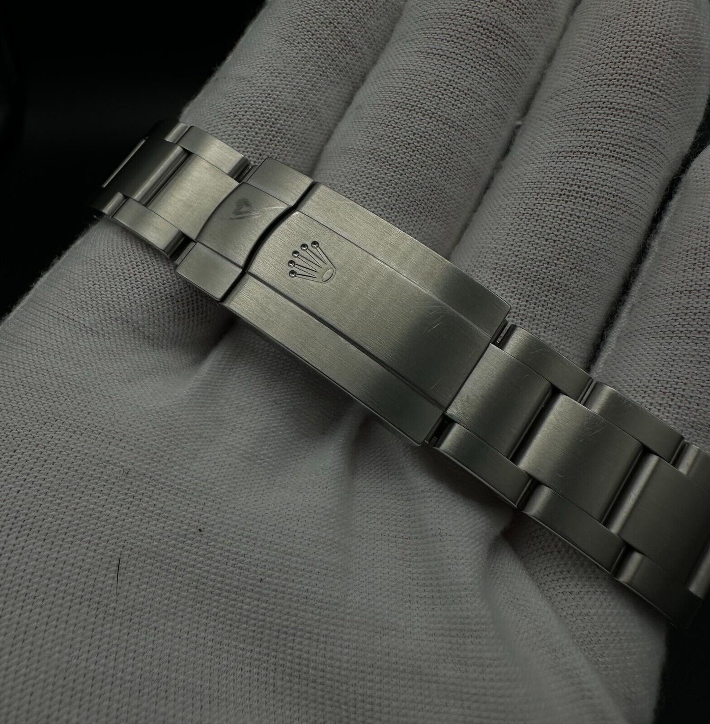 Rolex Oyster Perpetual 39mm watch, model 114300, featuring a sleek rhodium dial and durable steel oyster bracelet, 2019 release. This elegant timepiece combines modern aesthetics with Rolex's signature craftsmanship, ideal for those seeking a versatile luxury watch. Available from The Watch Trader CT.