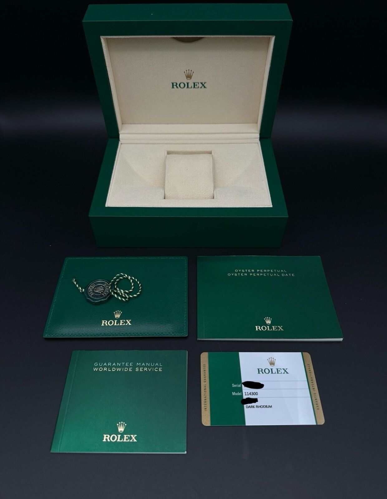 Rolex Oyster Perpetual 39mm watch, model 114300, featuring a sleek rhodium dial and durable steel oyster bracelet, 2019 release. This elegant timepiece combines modern aesthetics with Rolex's signature craftsmanship, ideal for those seeking a versatile luxury watch. Available from The Watch Trader CT.
