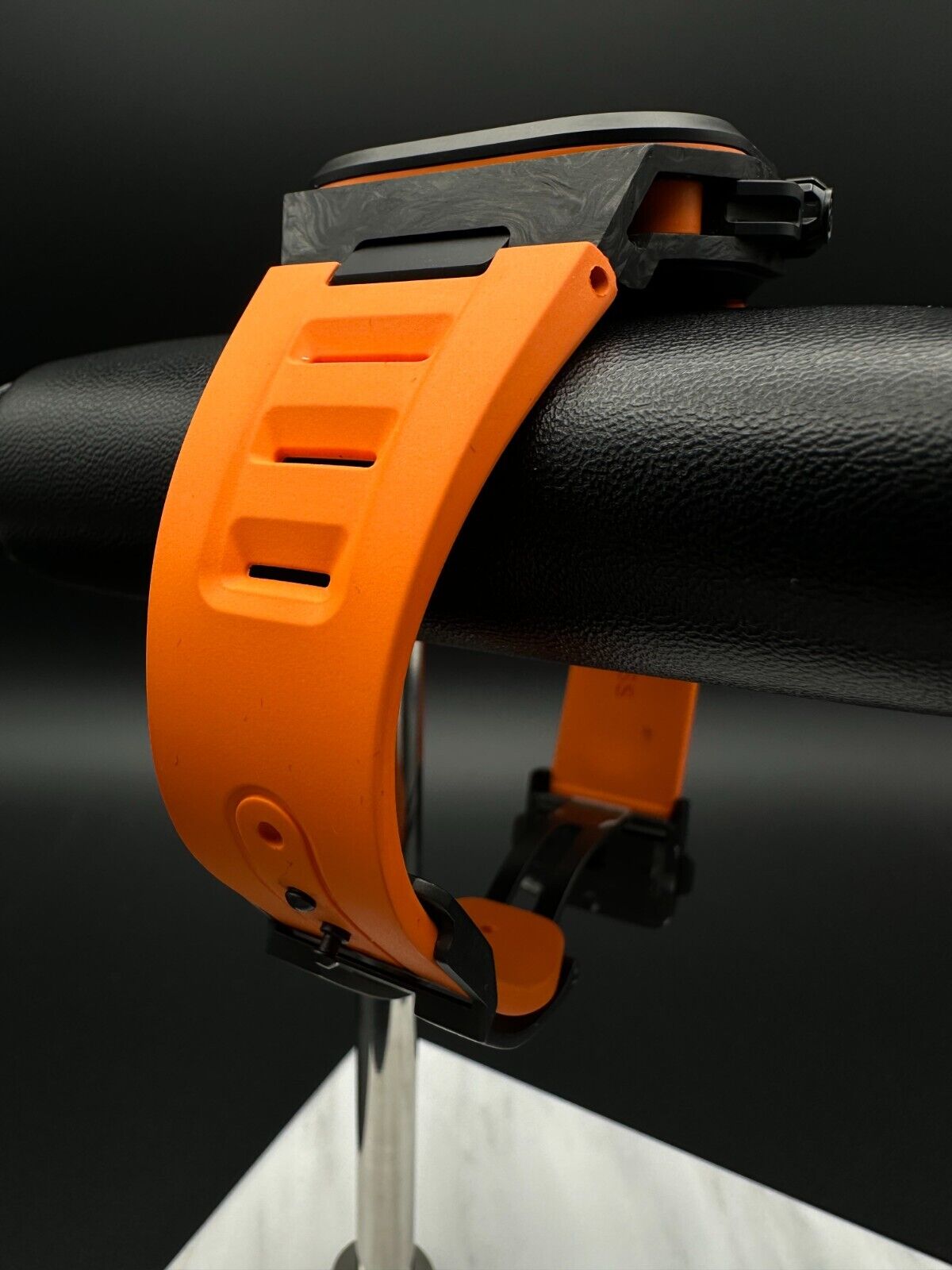 Bell & Ross Limited Edition BR-X5 Carbon Orange BRX5R-BO-TC/SRB, 2023 model, featuring a 41mm Grade 2 microblasted titanium case with DLC finish, matte black dial, and orange rubber strap with folding buckle. The dial has applique indices filled with Super-LumiNova® and skeletonized metal hands. The fixed bezel is made of Grade 2 microblasted titanium with a matt carbon fiber insert. Very good condition with minimal signs of wear. Limited edition of 500 pieces. Includes inner and outer boxes, warranty card,