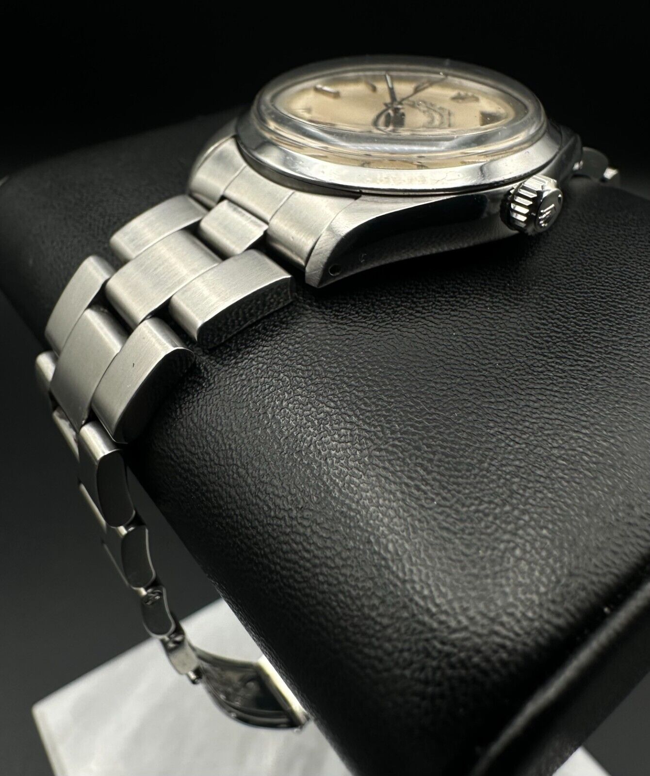Rolex Air-King 5500, 1987 model, featuring a 34mm stainless steel case, silver dial, and stainless steel Rolex Oyster bracelet. Fair condition with noticeable signs of wear. Includes warranty papers and service certificate. Available at The Watch Trader, Madison, Connecticut.