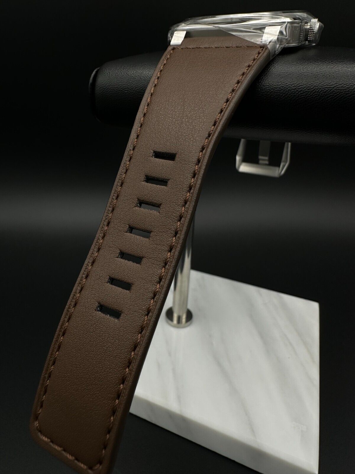 Bell & Ross BR-03 Golden Heritage 41mm men's watch featuring a striking brown sunray dial with gilt appliqué numerals and indices, metal skeletonized Super-LumiNova®-filled hands, and a smooth stainless steel bezel. The stainless steel case houses a 41mm diameter and is complemented by a brown calfskin leather strap. Brand new condition with original box, warranty card, user guide, and additional black canvas strap included. Available at The Watch Trader in Madison, Connecticut.