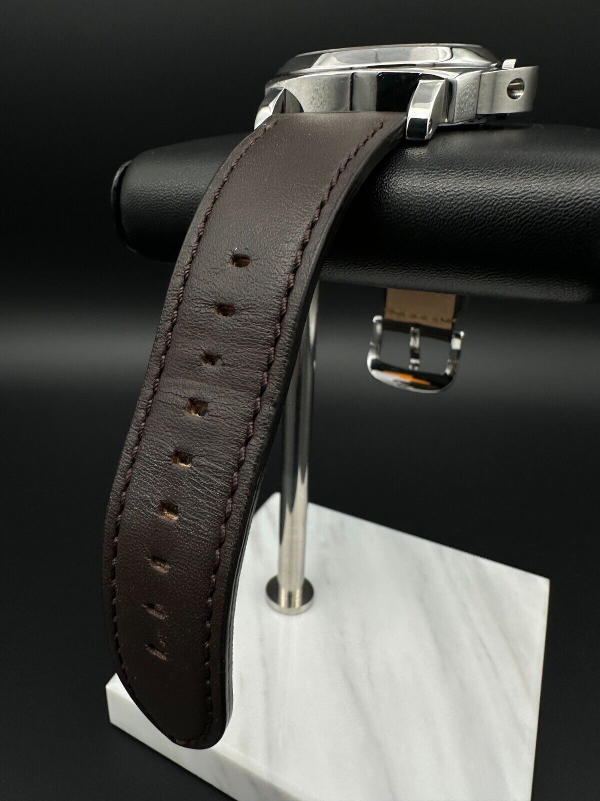 Panerai Luminor Marina PAM001 men's watch, featuring a 44mm stainless steel case and bold black dial. This iconic timepiece combines Panerai's renowned design with exceptional durability, making it ideal for collectors seeking a reliable and stylish luxury watch. Available from The Watch Trader in Madison, Connecticut.