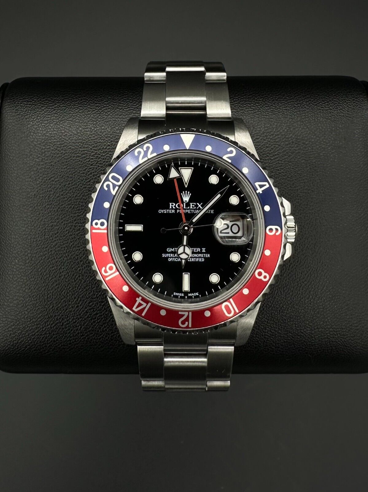 Rolex GMT-Master II automatic watch, model 16710, featuring the iconic 'Pepsi' bezel and stainless steel oyster bracelet, 2004 release. This 40mm timepiece combines functionality and classic style, ideal for collectors and travelers seeking a versatile luxury watch. Available from The Watch Trader CT.