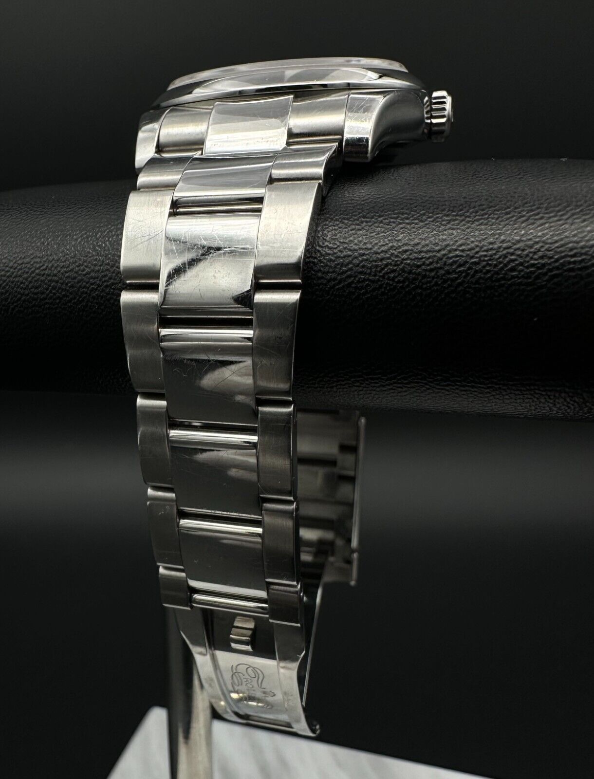 Rolex Datejust 36mm watch, model 116200, featuring a white Roman numeral dial and stainless steel Oyster bracelet. This classic automatic timepiece embodies refined elegance and versatility, perfect for collectors and enthusiasts seeking a timeless luxury watch. Available from The Watch Trader in Madison, Connecticut.