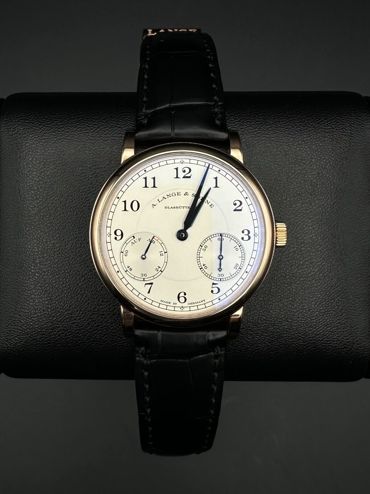 A. Lange & Söhne 1815 Up/Down 234.032, 39mm 18K rose gold case with silver dial, blued alpha-style hands, and power reserve indicator. Very good condition with minimal wear. Includes boxes, warranty booklet, microfiber cloths, and booklets. Available at The Watch Trader, Madison, Connecticut.