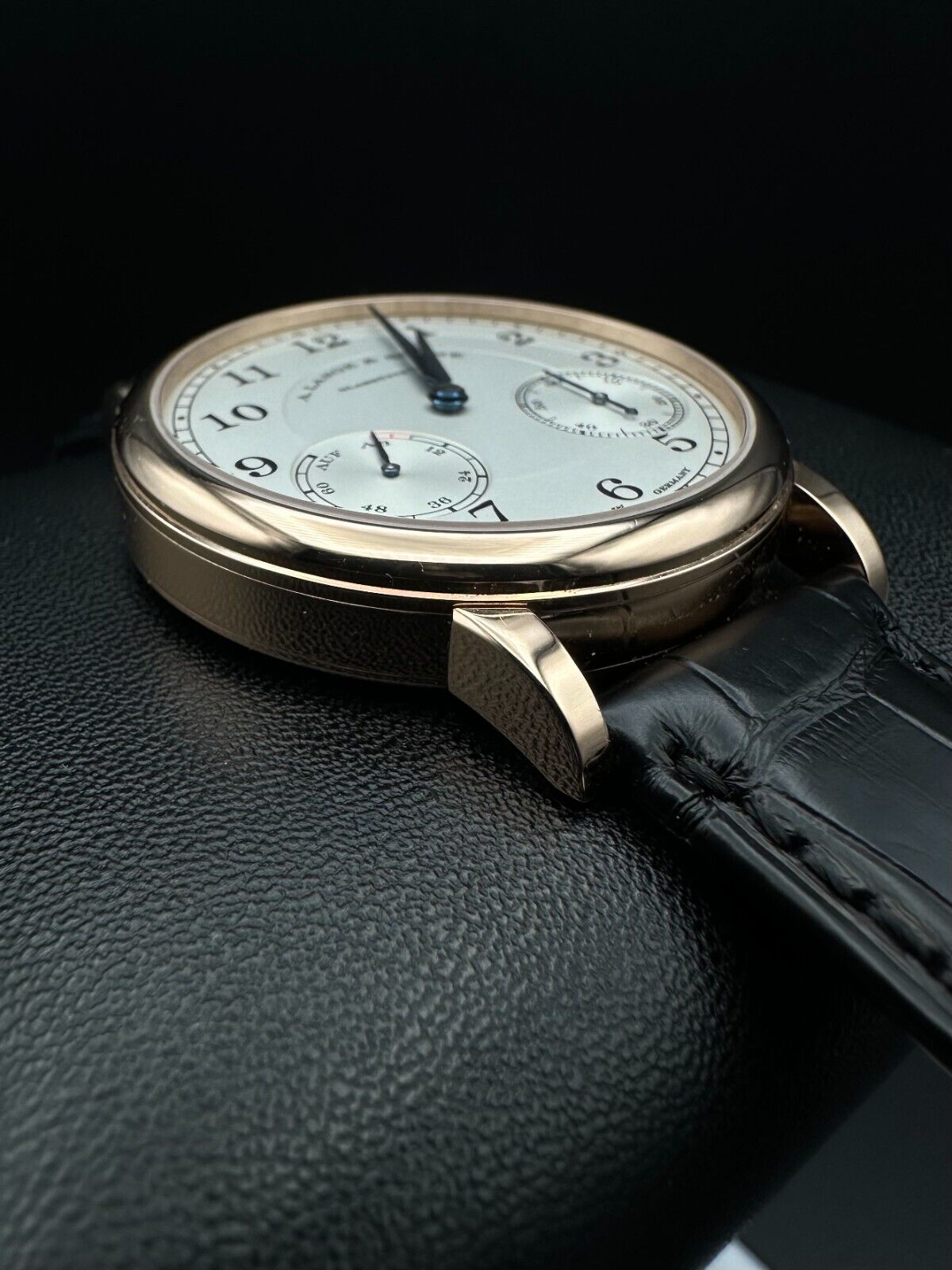 A. Lange & Söhne 1815 Up/Down 234.032, 39mm 18K rose gold case with silver dial, blued alpha-style hands, and power reserve indicator. Very good condition with minimal wear. Includes boxes, warranty booklet, microfiber cloths, and booklets. Available at The Watch Trader, Madison, Connecticut.