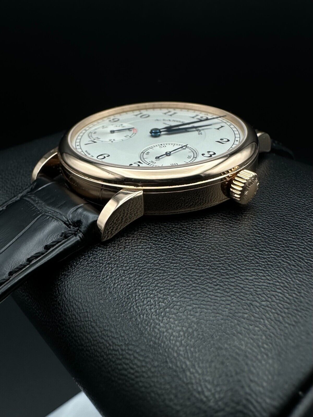 A. Lange & Söhne 1815 Up/Down 234.032, 39mm 18K rose gold case with silver dial, blued alpha-style hands, and power reserve indicator. Very good condition with minimal wear. Includes boxes, warranty booklet, microfiber cloths, and booklets. Available at The Watch Trader, Madison, Connecticut.
