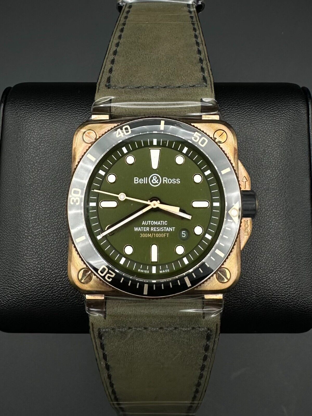 Bell & Ross BR03-92 Diver 42mm, 2024 limited edition, featuring a bronze case, green dial with gold-plated applique indices and Super-LumiNova®-filled hands. Comes with a green calfskin strap and a unidirectional rotating solid bronze bezel. Brand new condition with no signs of wear. Limited to 100 pieces. Includes inner and outer boxes, warranty card, user guide, two sizing tools, and an unworn black grooved rubber strap. Available at The Watch Trader, Madison, Connecticut.