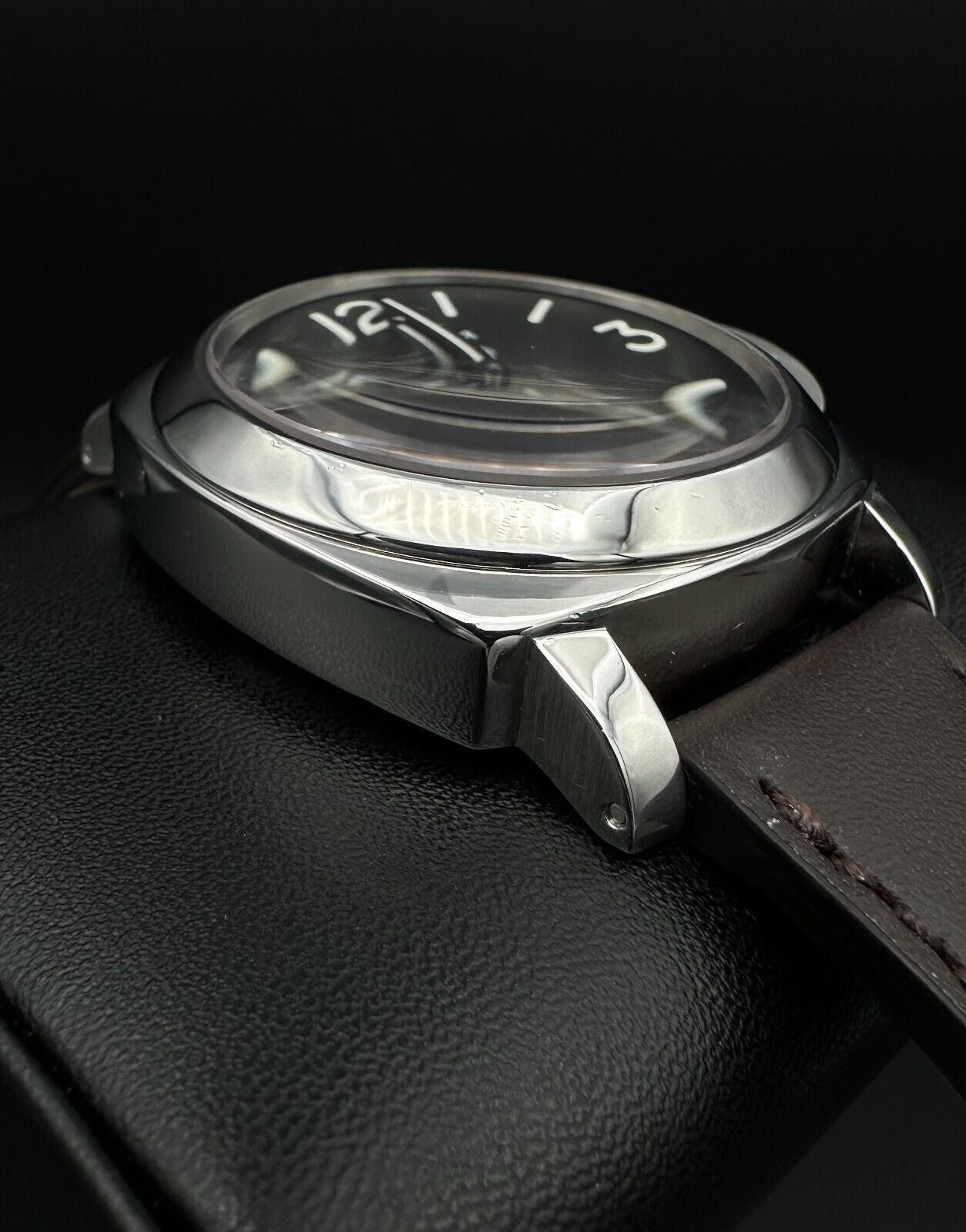 Panerai Luminor Marina PAM001 men's watch, featuring a 44mm stainless steel case and bold black dial. This iconic timepiece combines Panerai's renowned design with exceptional durability, making it ideal for collectors seeking a reliable and stylish luxury watch. Available from The Watch Trader in Madison, Connecticut.