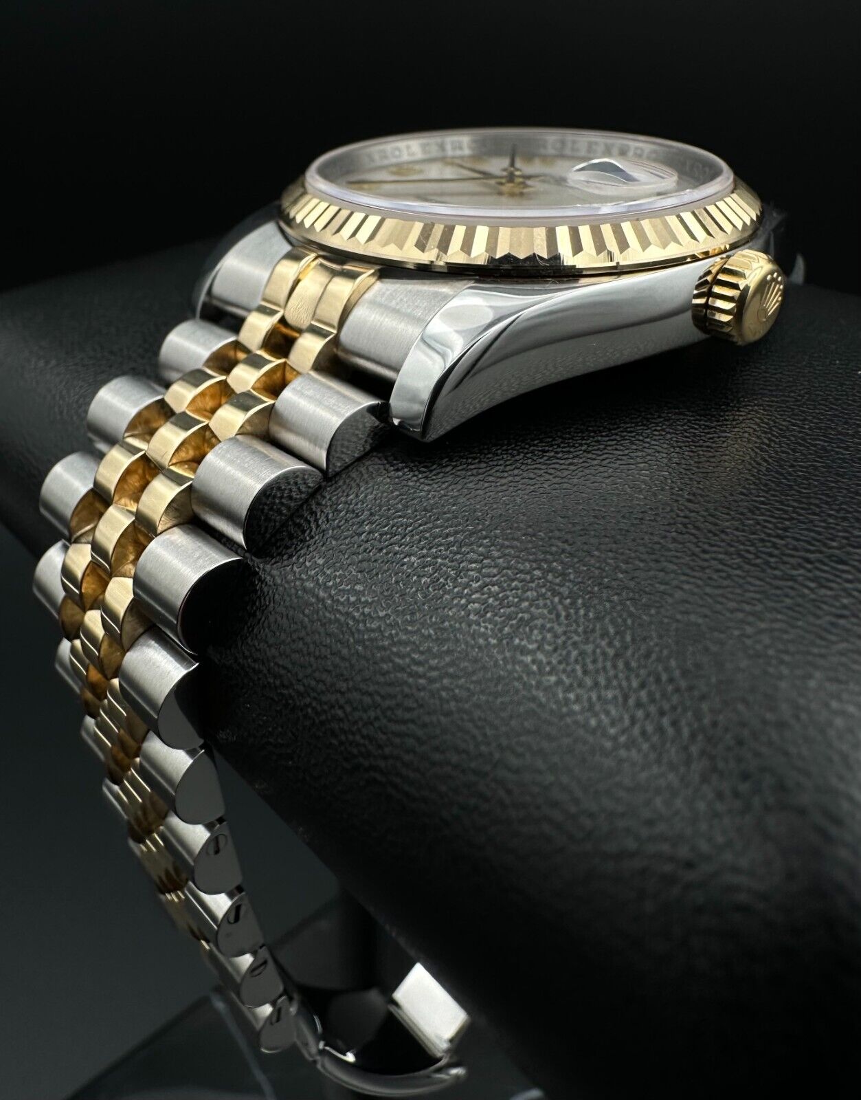 Rolex Datejust 36mm automatic watch, model 116233, featuring a white Anniversary dial and Super Jubilee bracelet. This sophisticated timepiece combines elegant design with Rolex's signature craftsmanship, ideal for collectors and enthusiasts seeking a refined luxury watch. Available from The Watch Trader in Madison, Connecticut