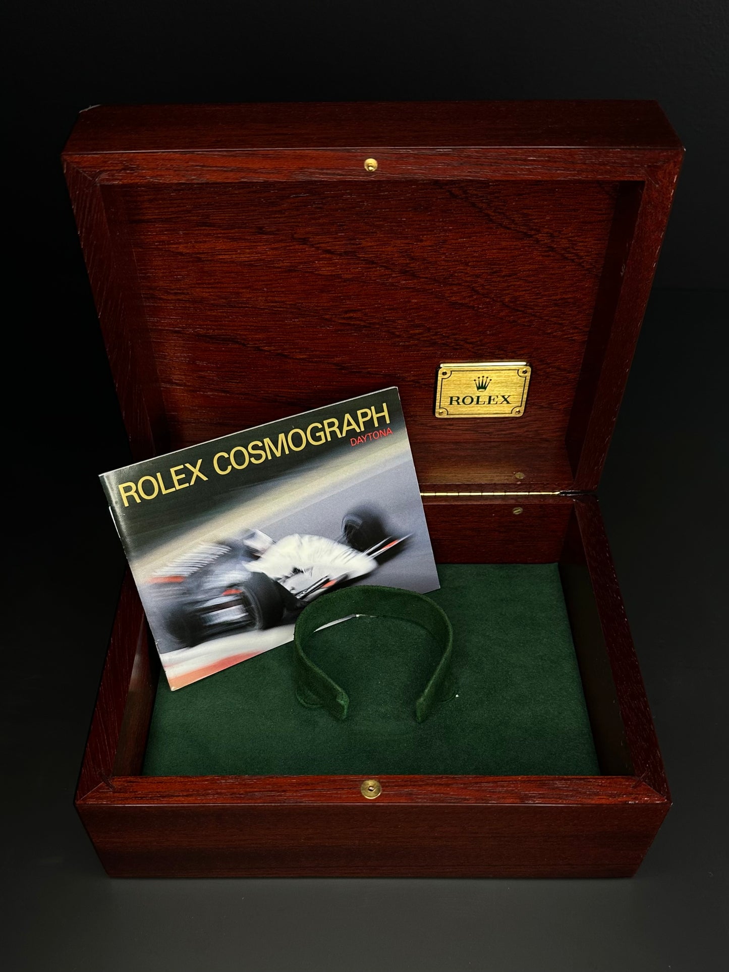 Rolex Cosmograph Daytona men’s automatic watch, model 16528, featuring a rare floating porcelain dial and crafted in 18k yellow gold, from 1987. This vintage 40mm timepiece combines iconic Daytona functionality with unique collectible appeal, ideal for discerning collectors of rare luxury watches. Available from The Watch Trader in Madison, Connecticut.