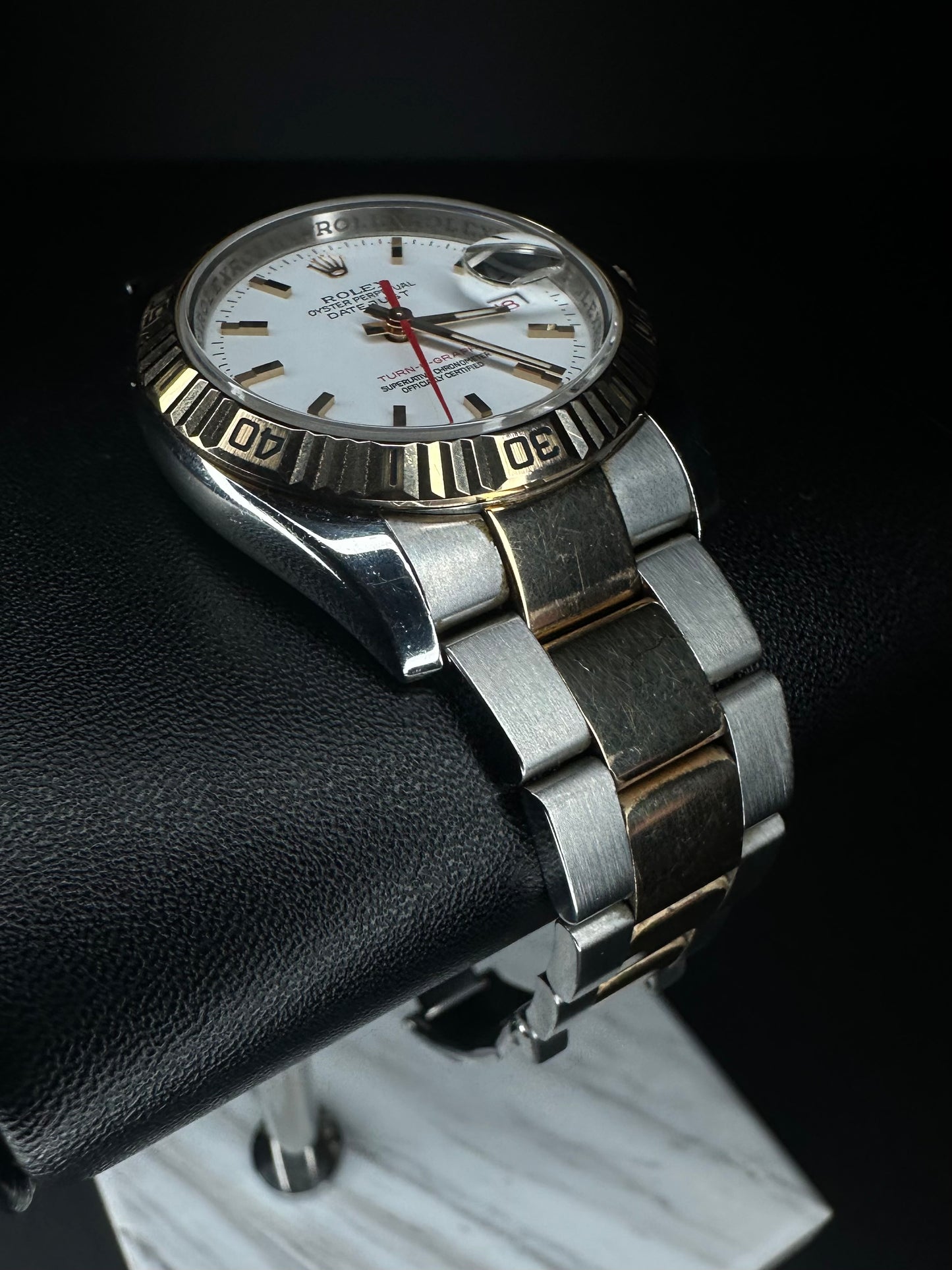 Rolex Datejust Turn-O-Graph 116261 men's automatic watch, featuring a 36mm stainless steel and rose gold case with a classic Oyster bracelet. This elegant timepiece combines the iconic Datejust design with a rotating bezel, ideal for collectors seeking a versatile luxury watch. Available from The Watch Trader CT.