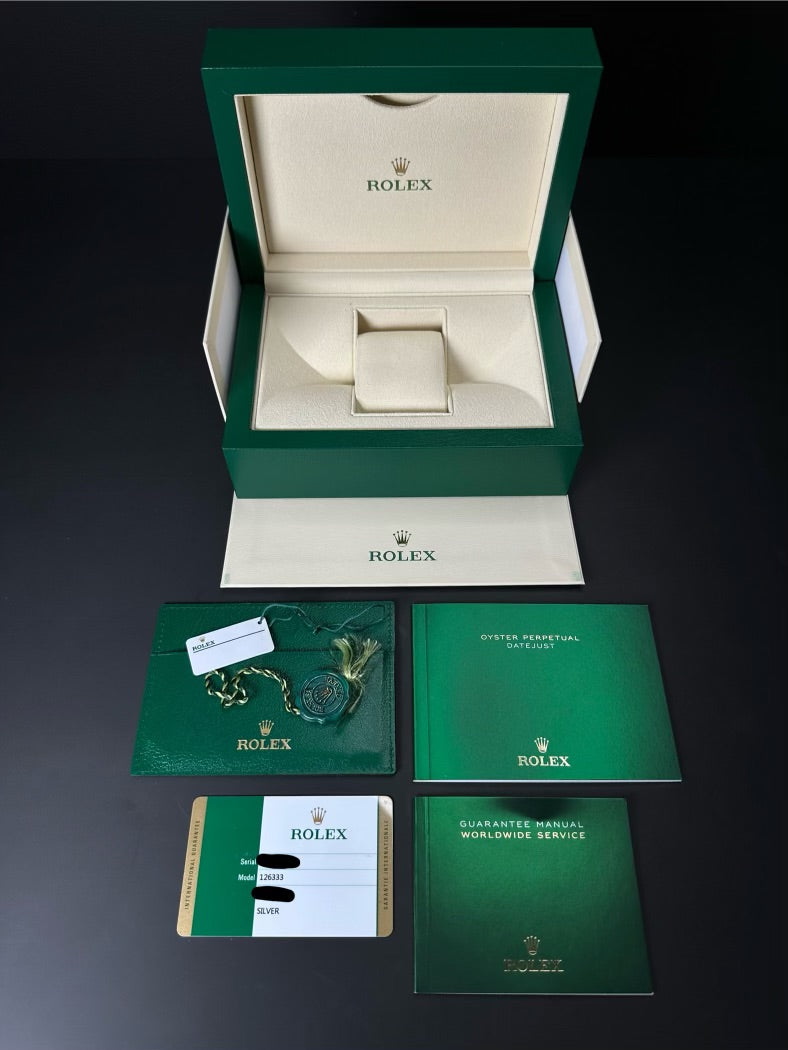 Rolex Datejust 41mm automatic watch, model 126333, featuring a two-tone yellow gold and stainless steel case with a silver dial, 2019 release. This elegant timepiece combines classic design with modern size, perfect for collectors seeking a versatile and luxurious watch. Available from The Watch Trader CT.
