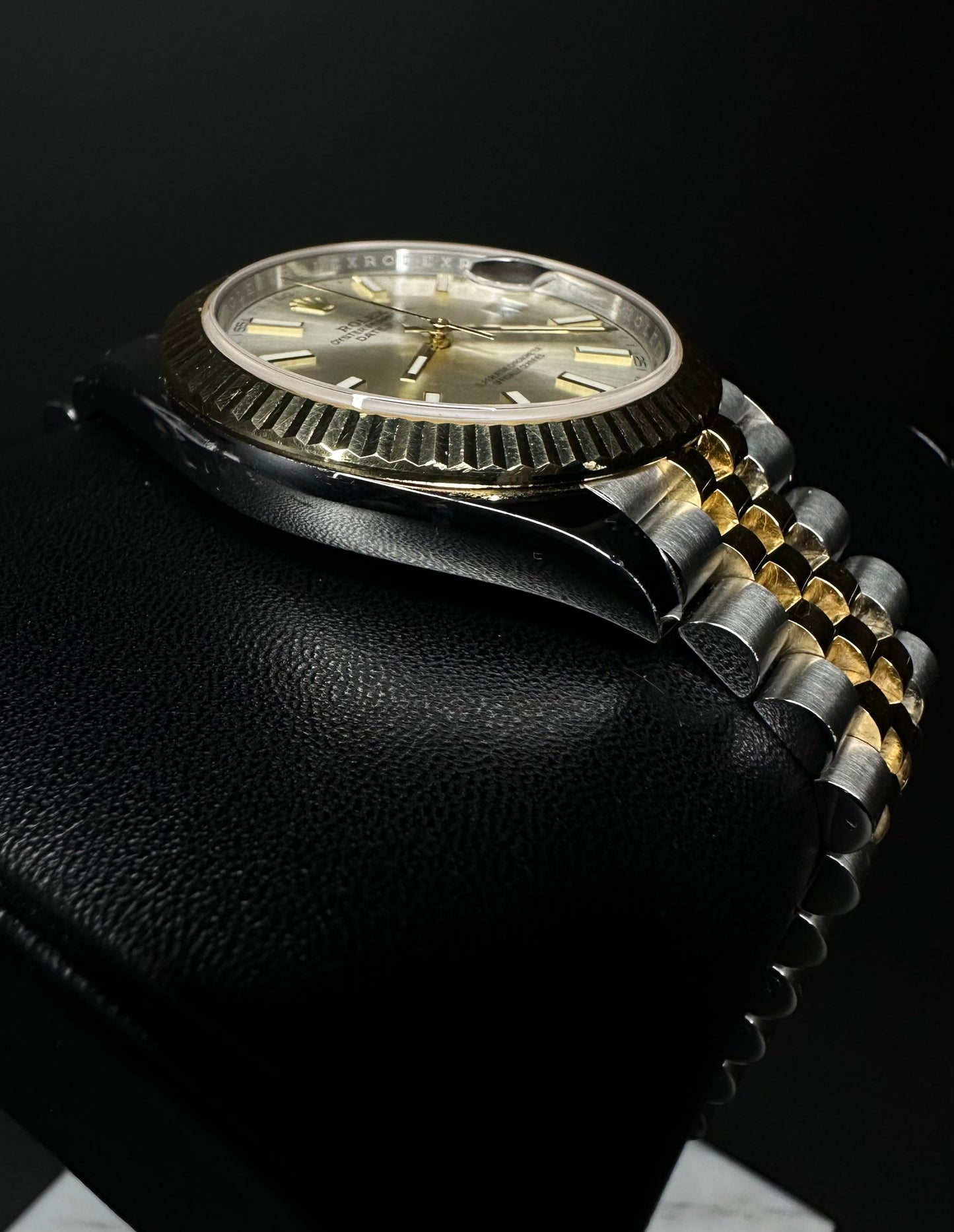 Rolex Datejust 41mm automatic watch, model 126333, featuring a two-tone yellow gold and stainless steel case with a silver dial, 2019 release. This elegant timepiece combines classic design with modern size, perfect for collectors seeking a versatile and luxurious watch. Available from The Watch Trader CT.